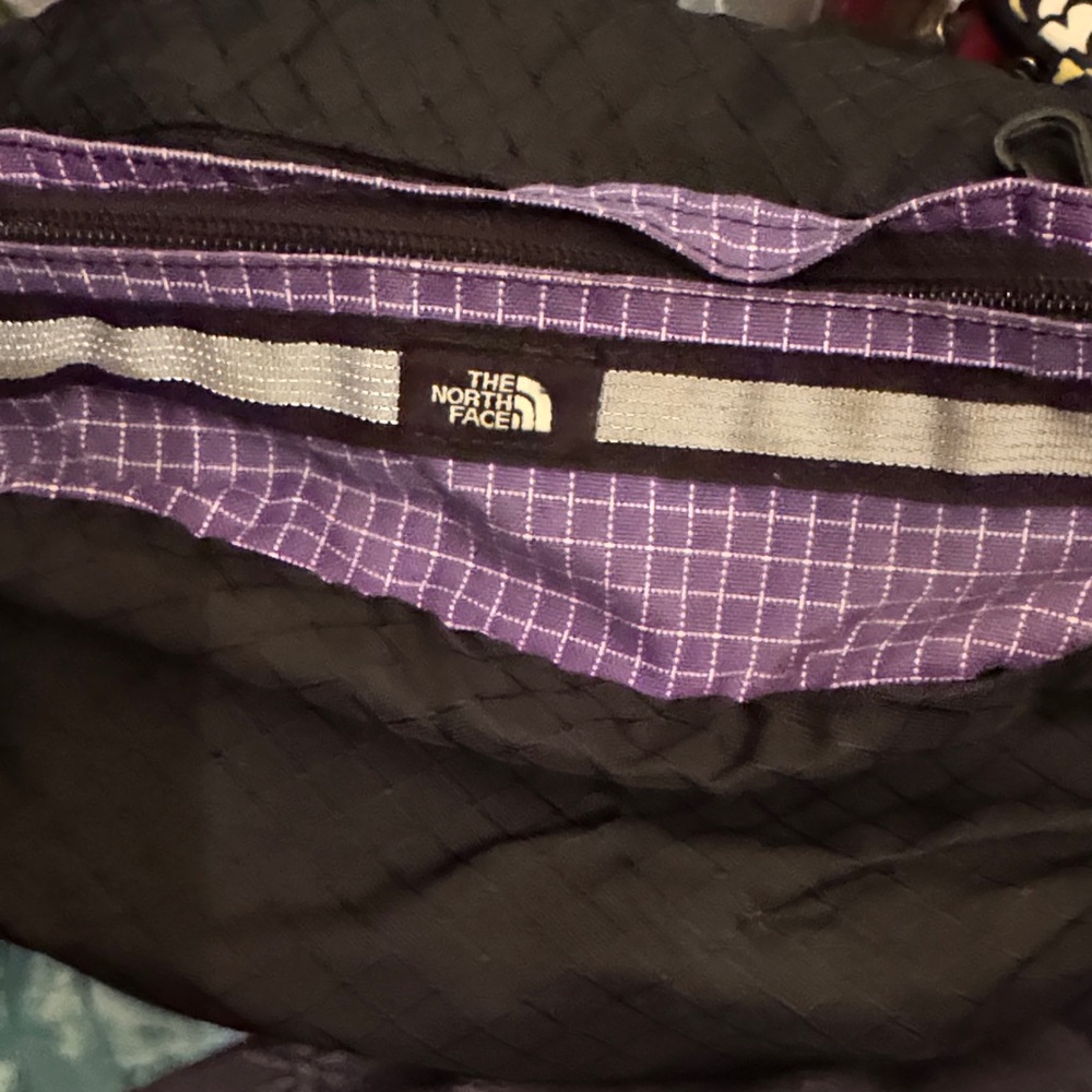 The North Face Black and Purple Fanny Pack oversized.
